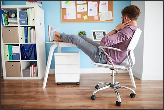 A Man resting on his desk